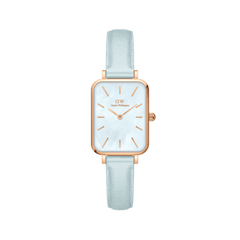 Rectangular rose gold women’s watch with a blue mother of pearl dial and pastel blue Italian leather strap.