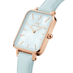 Quadro Bluebell Rose Gold women’s watch featuring a rectangular rose gold case, blue mother of pearl dial, and pastel blue Italian leather strap.