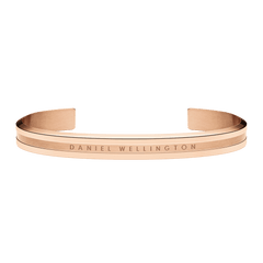 Daniel Wellington Elan Bracelet in rose gold with a slim open cuff design, engraved logo, and smooth polished finish.
