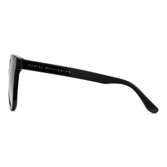 Side view of the Grande Bio-Acetate Black Blue sunglasses showing the sleek black bio-acetate arm with Daniel Wellington branding.